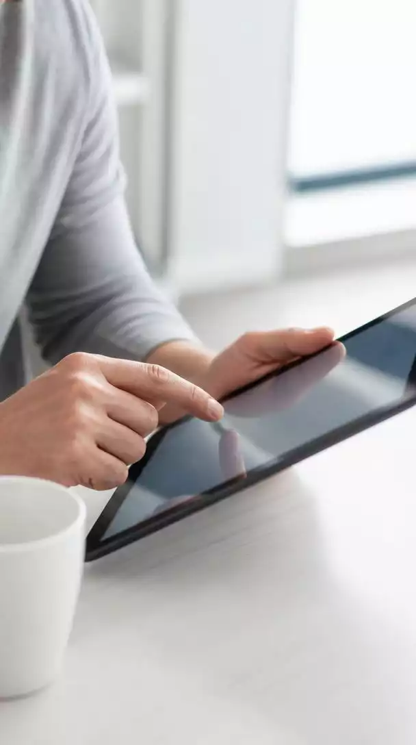 User submitting online form on tablet